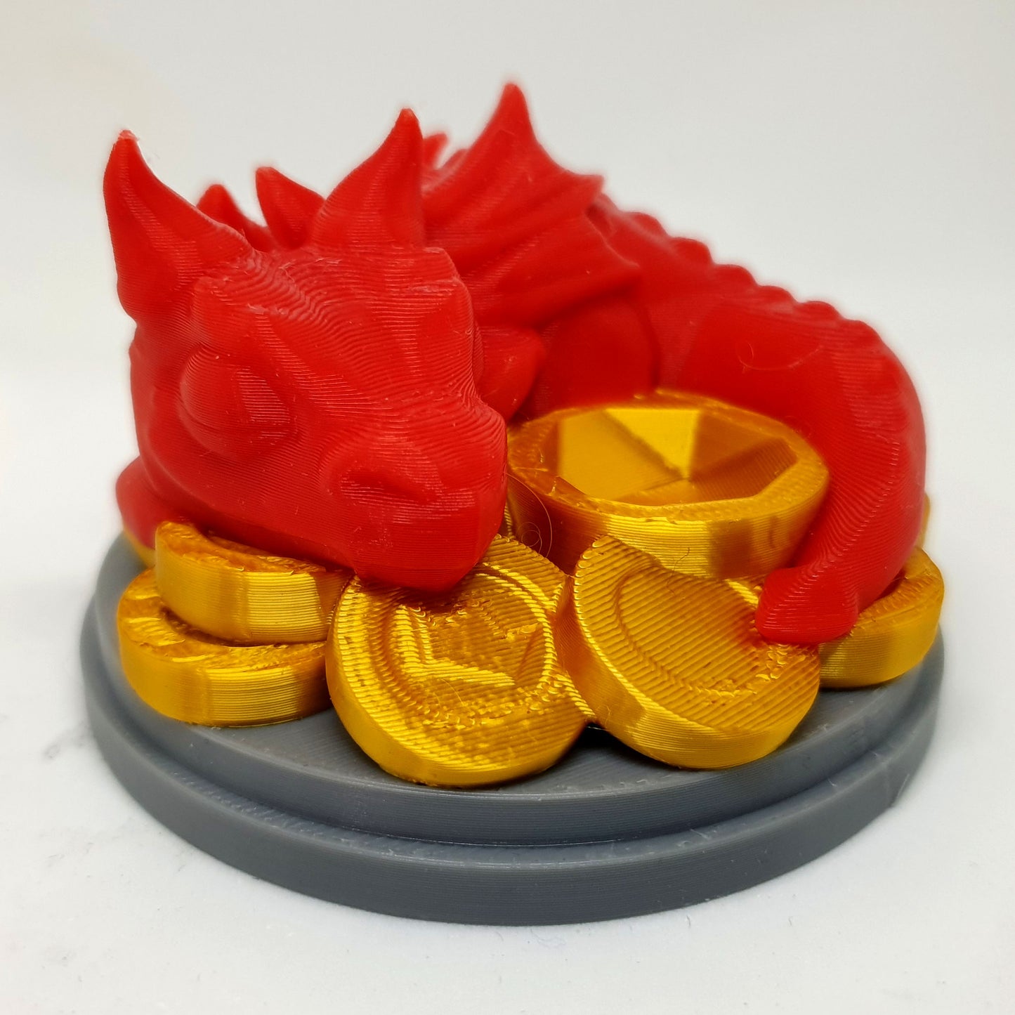Baby Dragon On Coins Dice Guardian