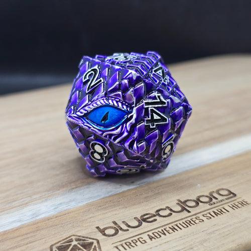 Amethyst Dragon Eye 34mm metal D20 chonk in purple and silver with blue eye