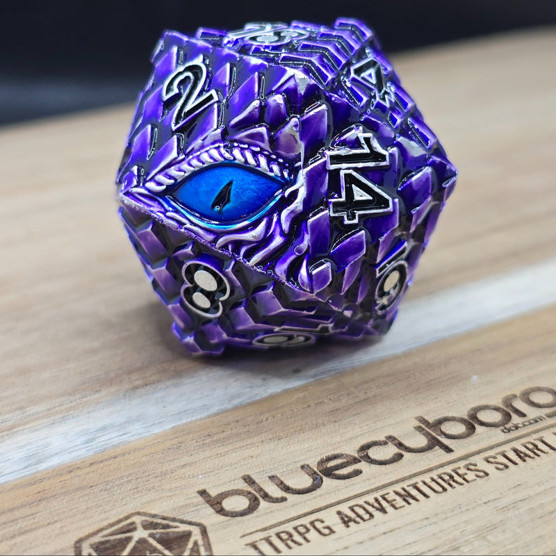 Amethyst Dragon Eye 34mm metal D20 chonk in purple and silver with blue eye