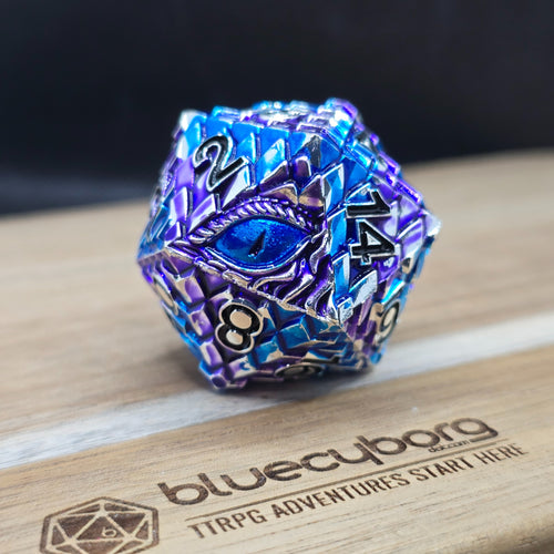 Arcane Dragon Eye 34mm metal D20 chonk in blue, purple and silver with blue eye