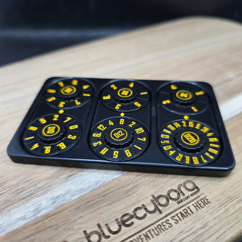 Black and yellow metal credit card shaped RPG dice spinner