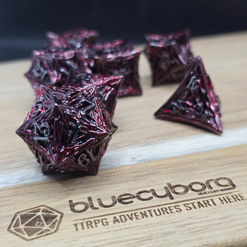Bloodthorn Crimson Black metal dice set with spiked angular shape, dark red metallic finish and silver numbers