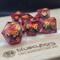Dragon Eye Crimson Gaze moving eye liquid core resin dice set with crimson resin, gold numbers and fiery dragon eye design