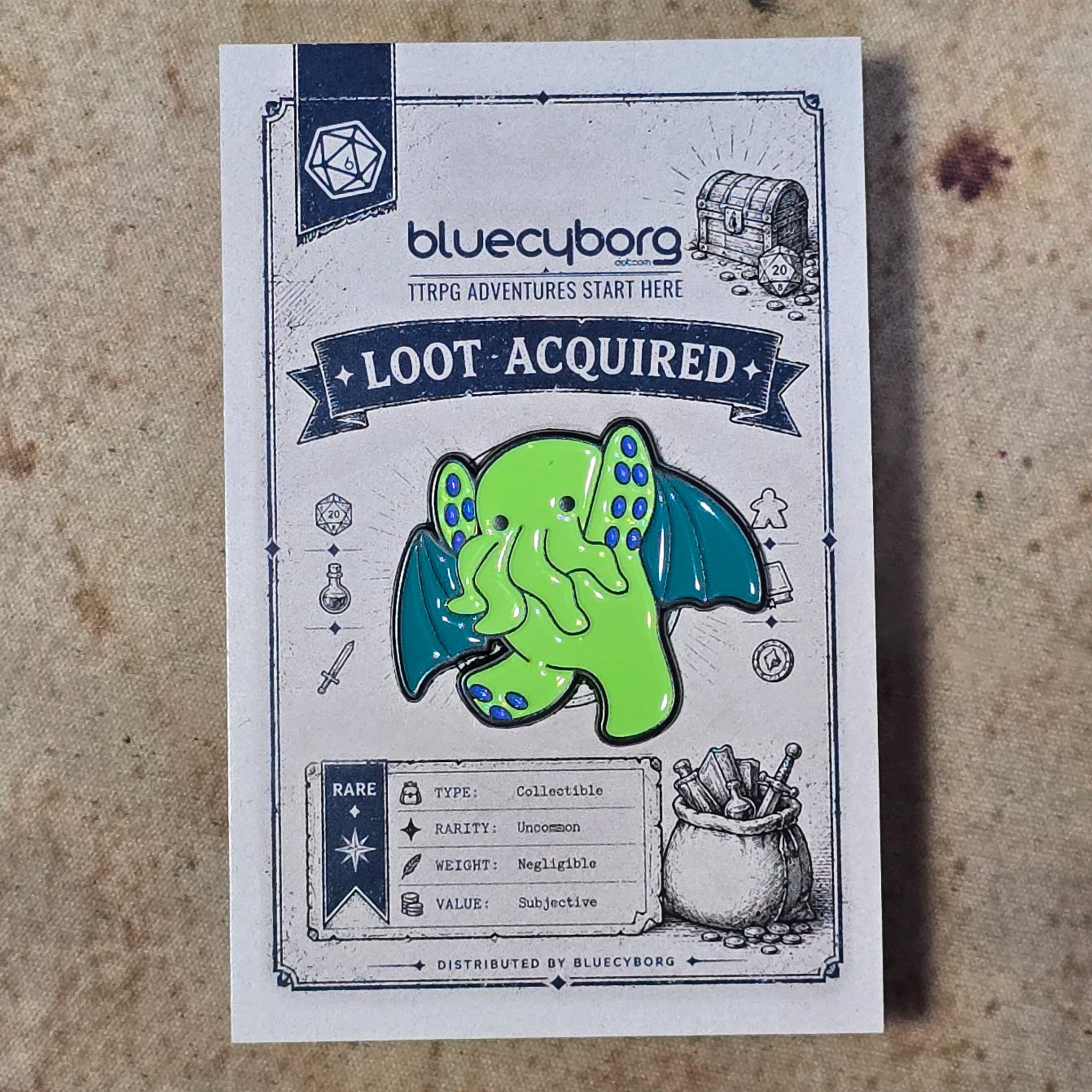 Eldritch Stomp enamel pin badge on BlueCyborg loot card