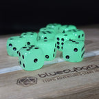 Ghostlight acrylic D6 dice set glowing green in the dark