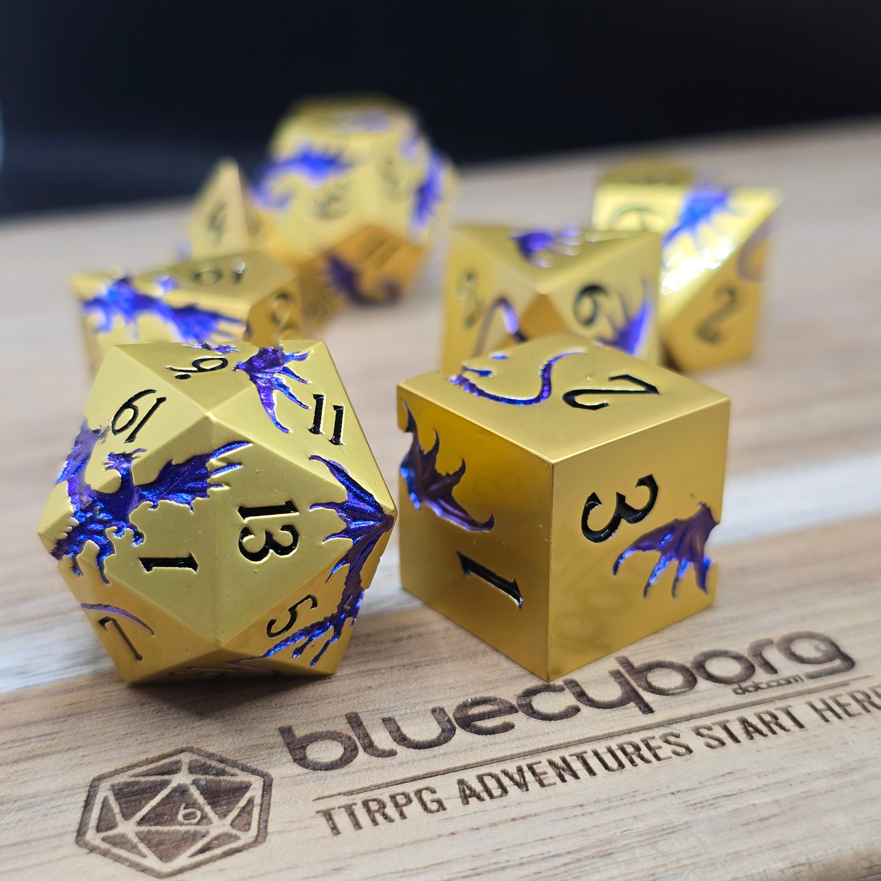 Golden Wyrm gold metal dice set with blue purple dragon detailing