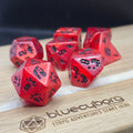 Jurassic Inferno red lava coloured acrylic dinosaur dice set with black details