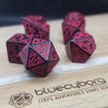Bloodthorn Runebound acrylic dice set in black with crimson red knotwork