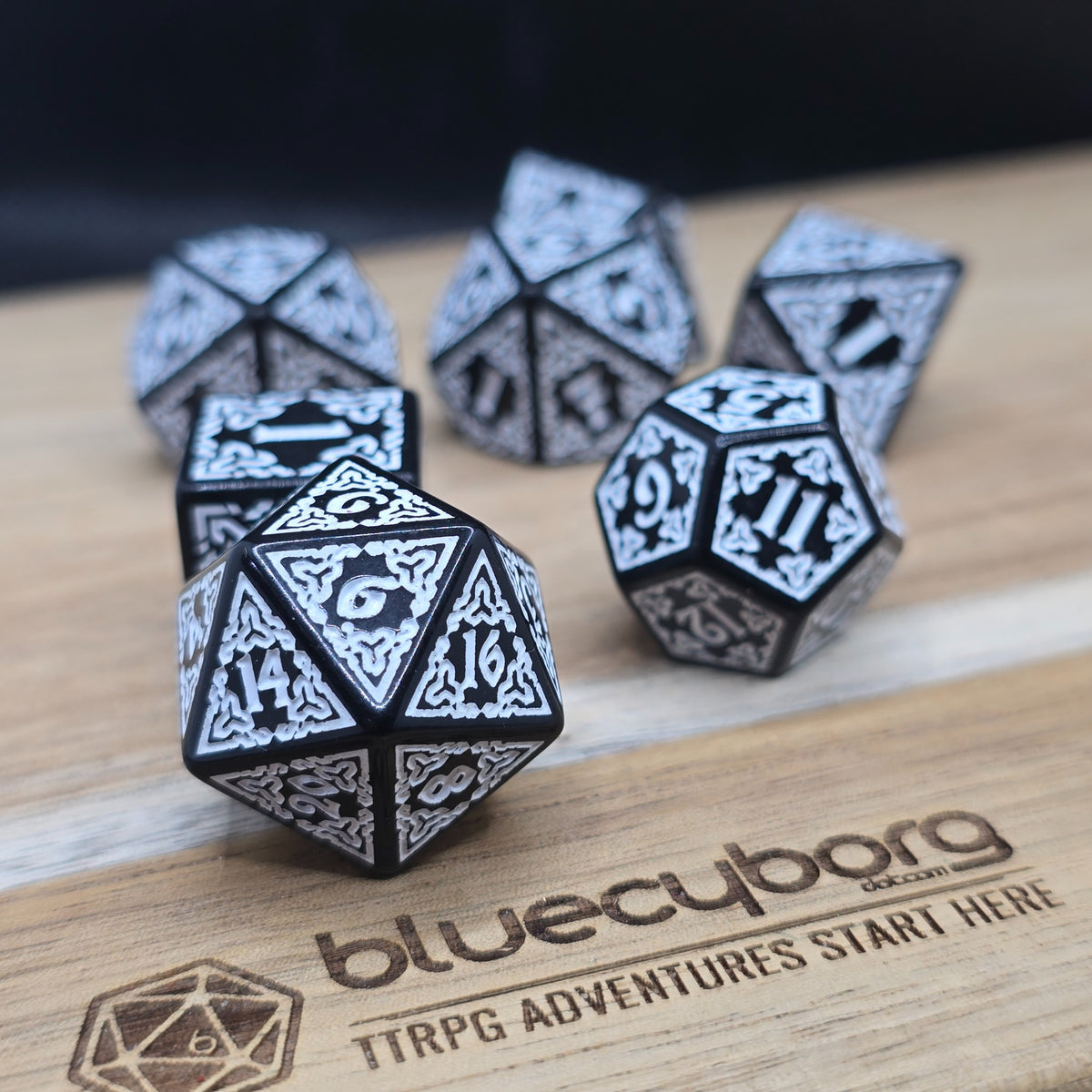 Frostveil Runebound acrylic dice set in black with silver-white knotwork