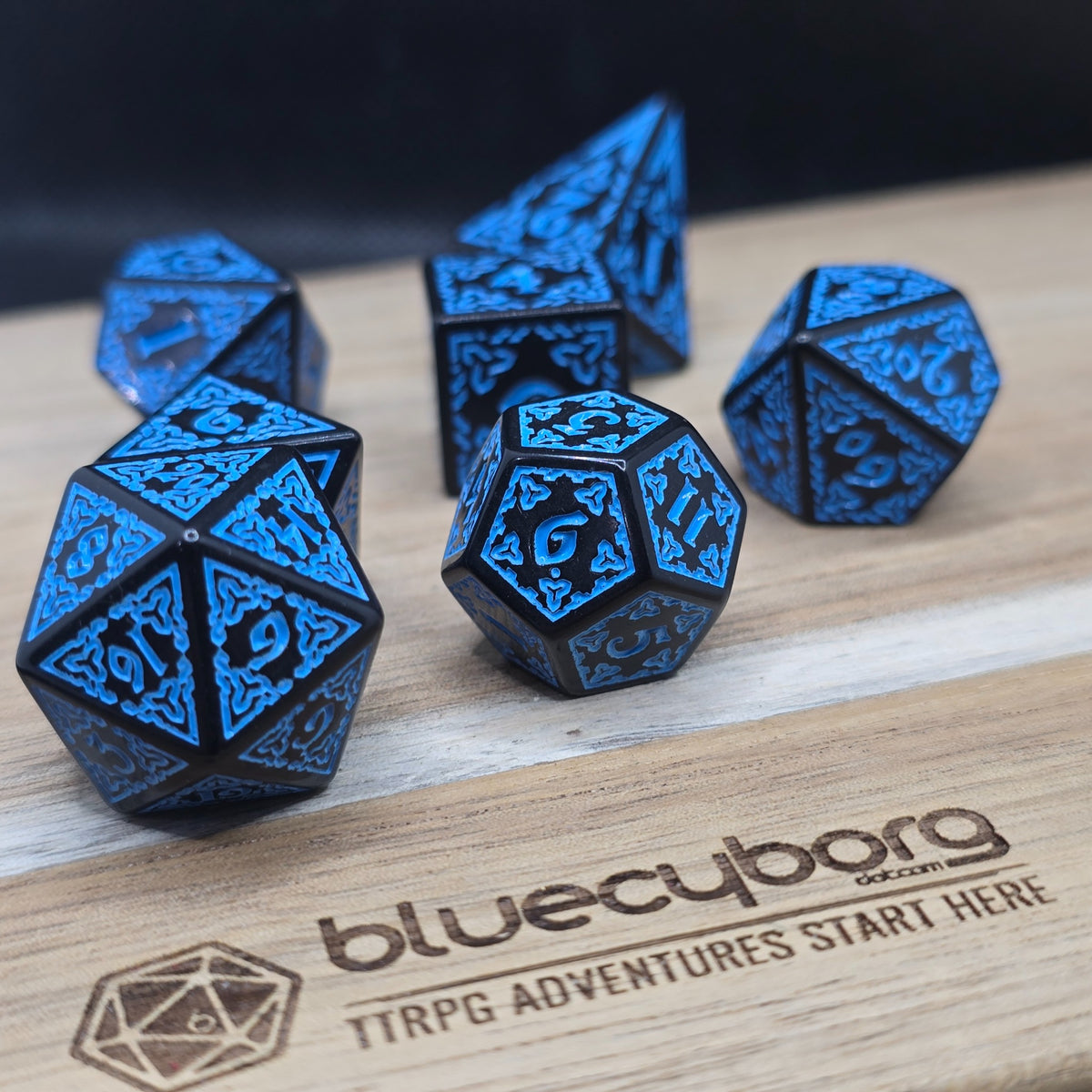Stormcaller Runebound acrylic dice set in black with electric blue knotwork