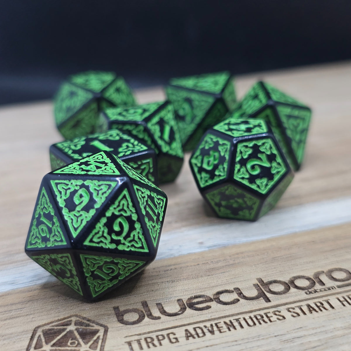 Thornwood Runebound acrylic dice set in black with bright green knotwork