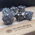 Silver Steampunk hollow metal dice set with gears and mechanical detailing