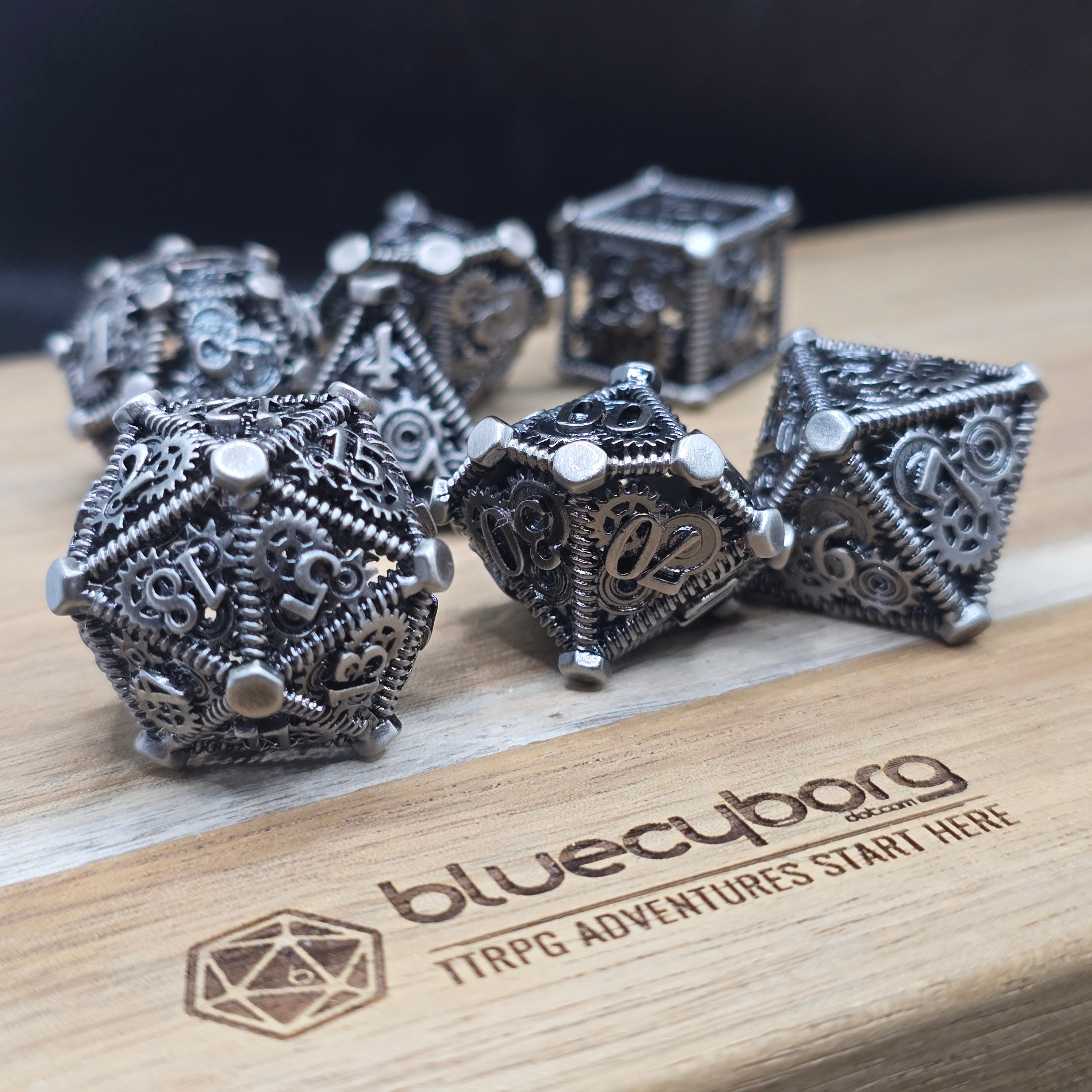 Silver Steampunk hollow metal dice set with gears and mechanical detailing