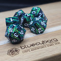 Void Emerald Shard black and green solid metal dice set