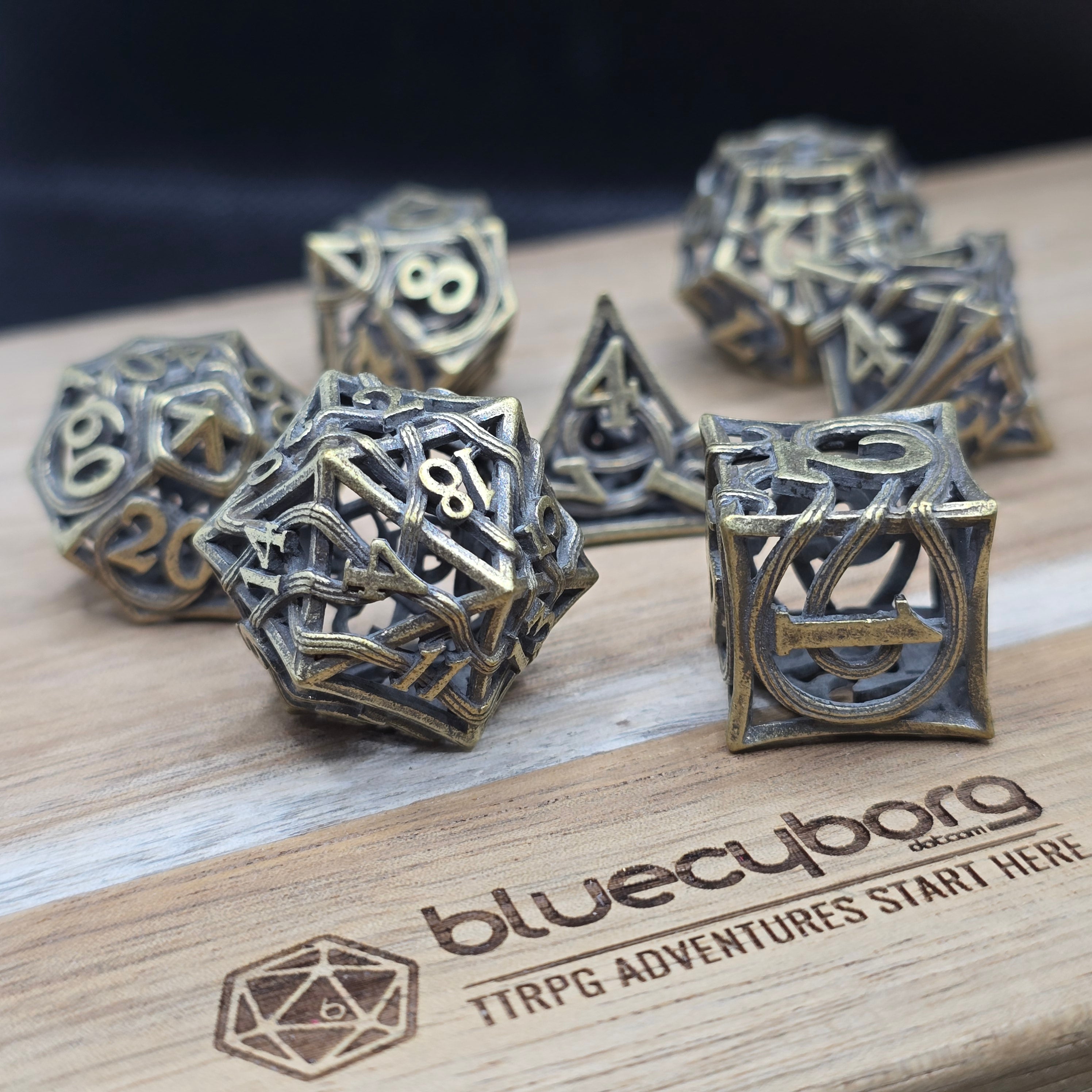 Worn Vines aged metal hollow RPG dice set